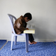 An Uighur refugee boy reads the Koran in Kayseri.
